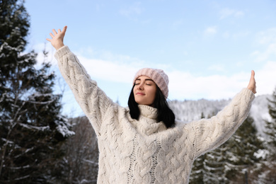 Photo of Beautiful young woman enjoying vacation on winter day