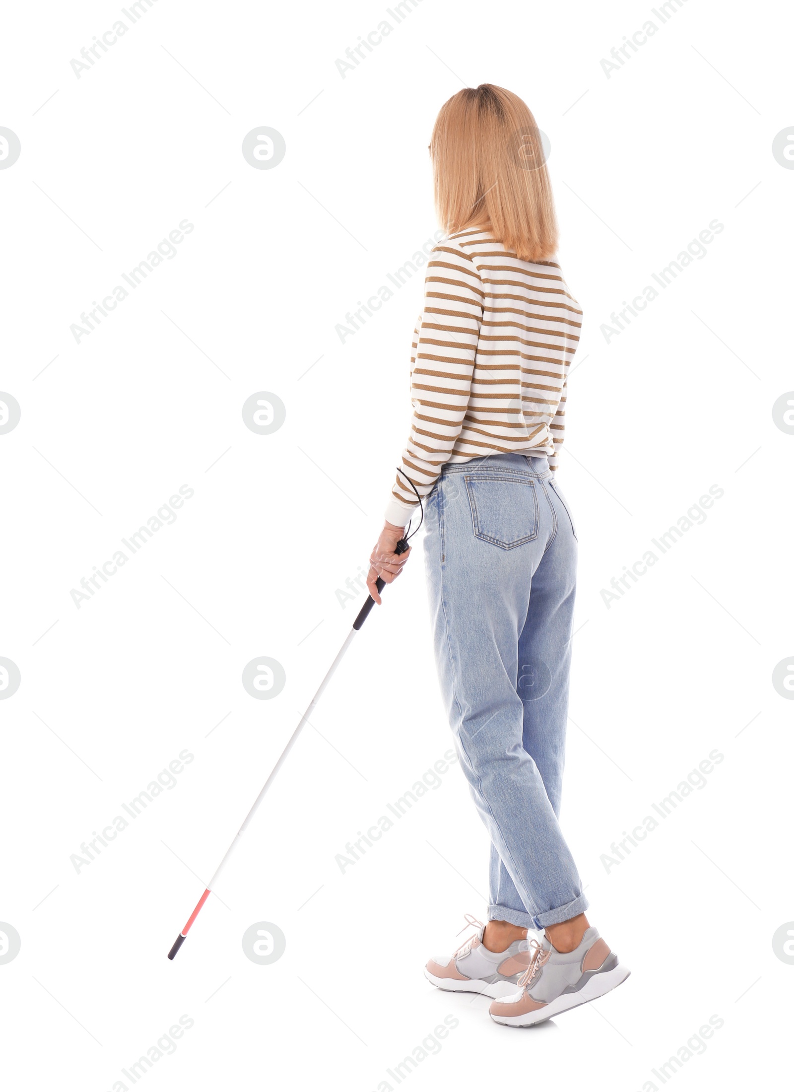 Photo of Blind person with long cane walking on white background