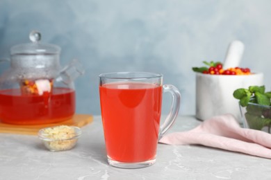 Immunity boosting drink on light grey marble table