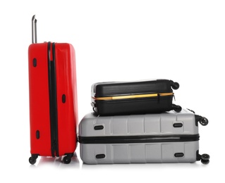 Photo of Modern suitcases for travelling on white background