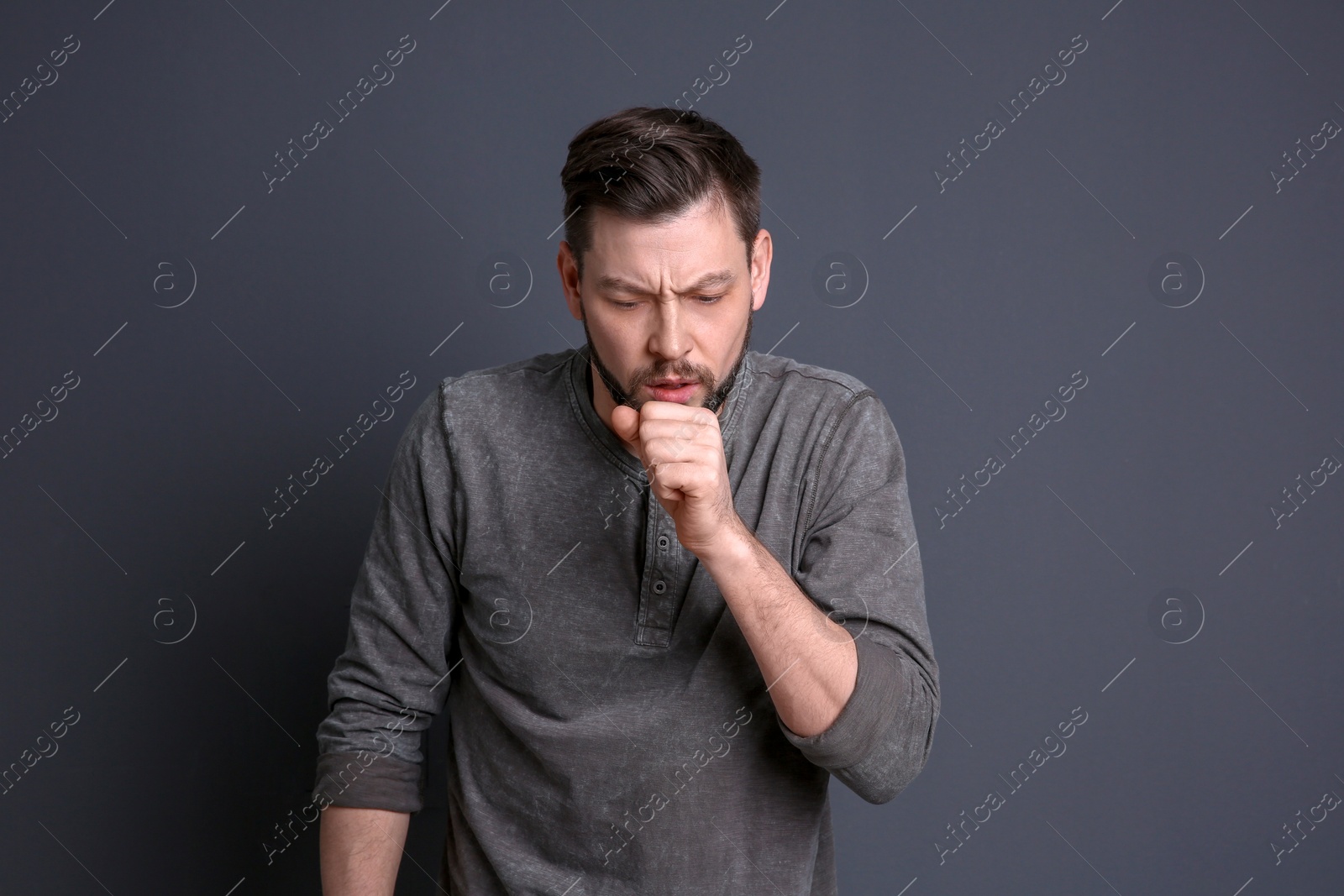 Photo of Mature man coughing on color background