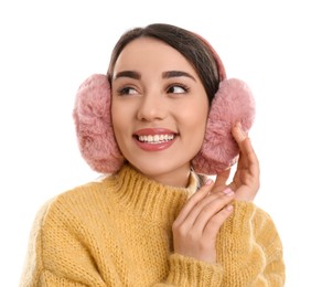 Photo of Beautiful young woman wearing earmuffs on white background