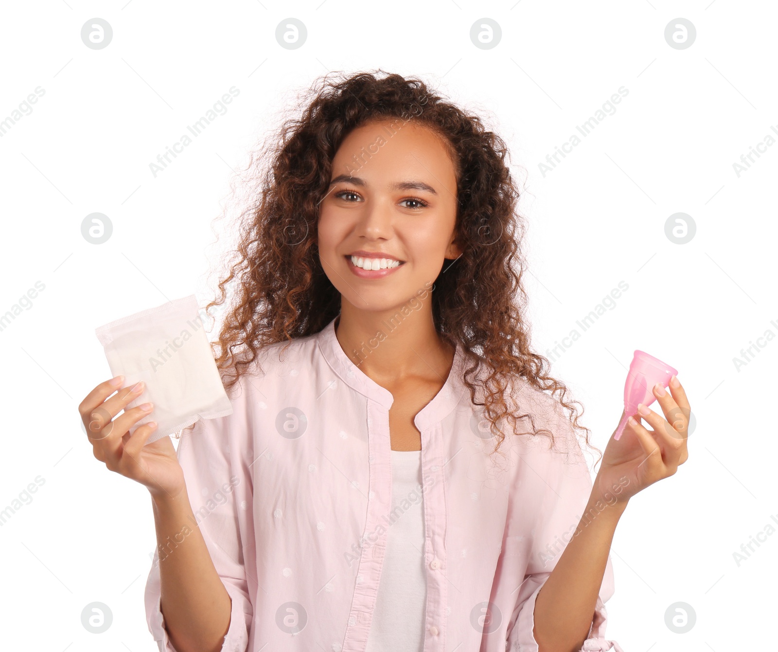 Photo of Young African American woman with menstrual cup and pad on white background