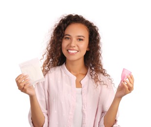 Photo of Young African American woman with menstrual cup and pad on white background