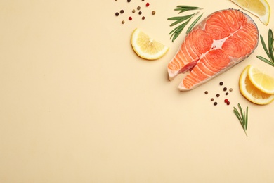 Flat lay composition with salmon steak on light background. Space for text