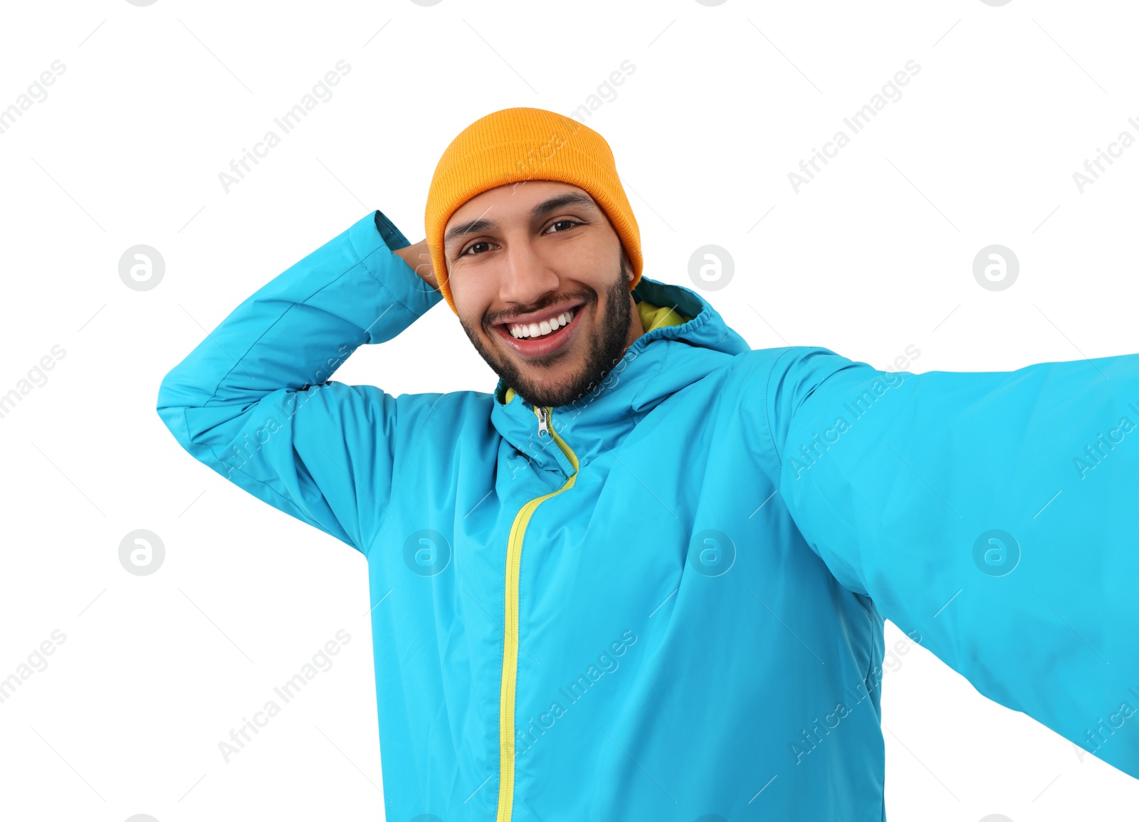 Photo of Smiling young man taking selfie on white background