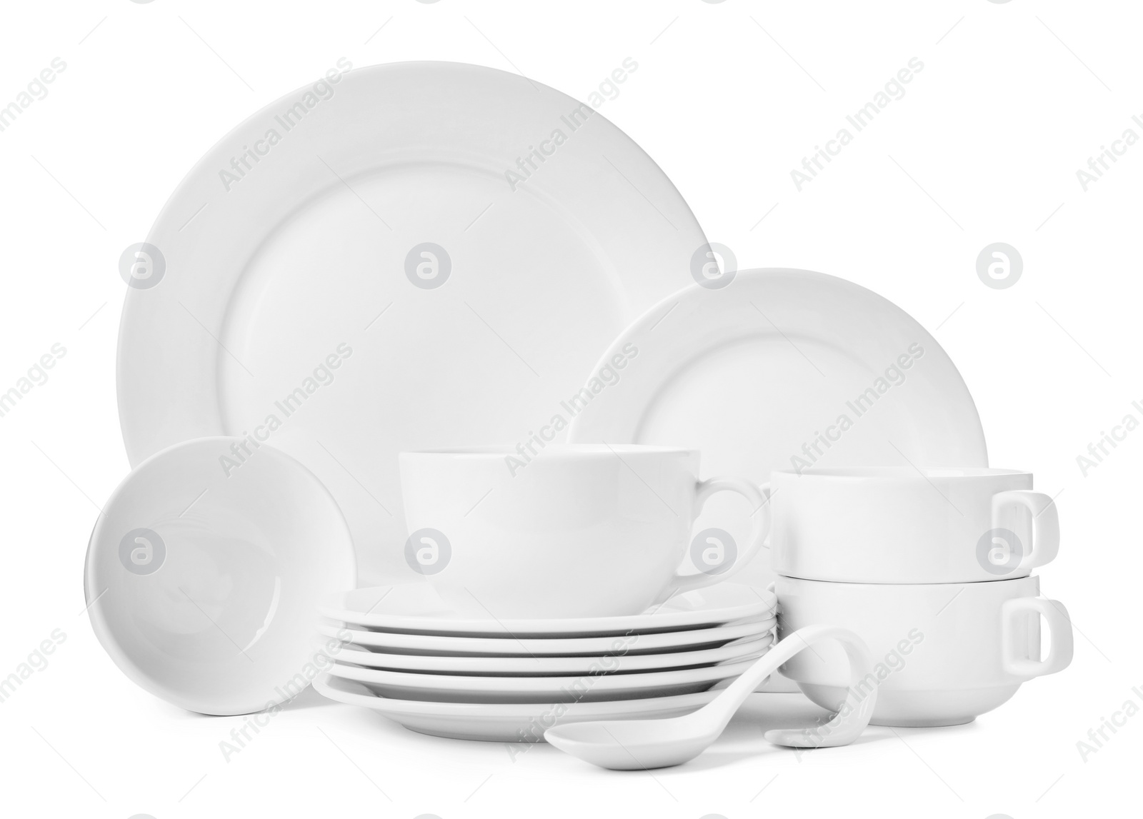 Photo of Set of clean dishware isolated on white