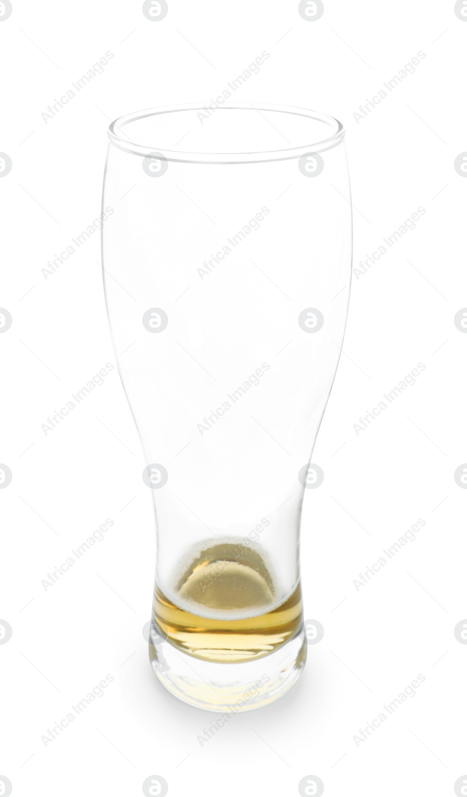 Photo of Almost empty glass of beer isolated on white