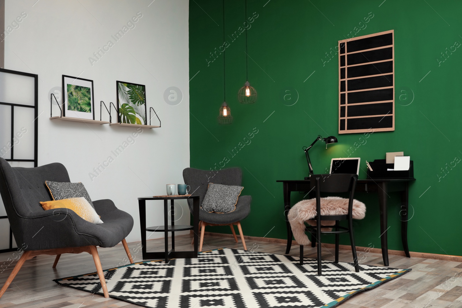 Photo of Modern living room interior with workplace near green wall