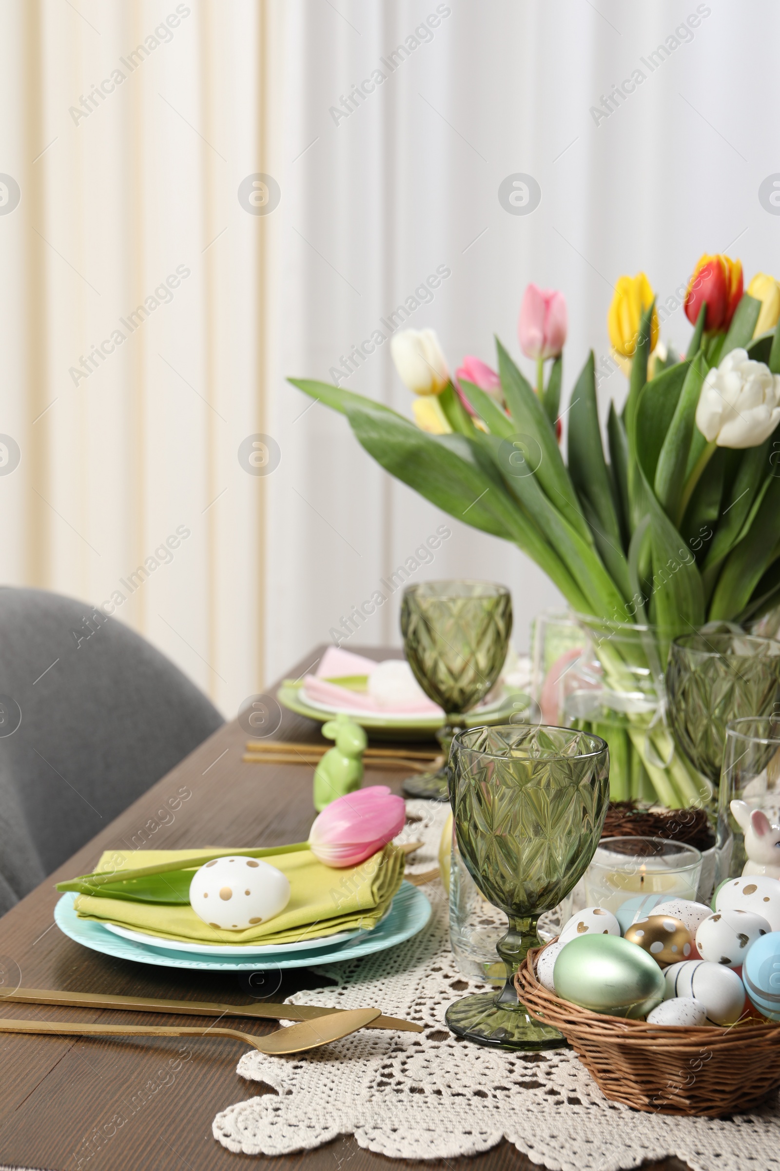 Photo of Festive table setting with beautiful flowers. Easter celebration