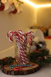 Photo of Christmas decor and candy canes on countertop in kitchen, closeup