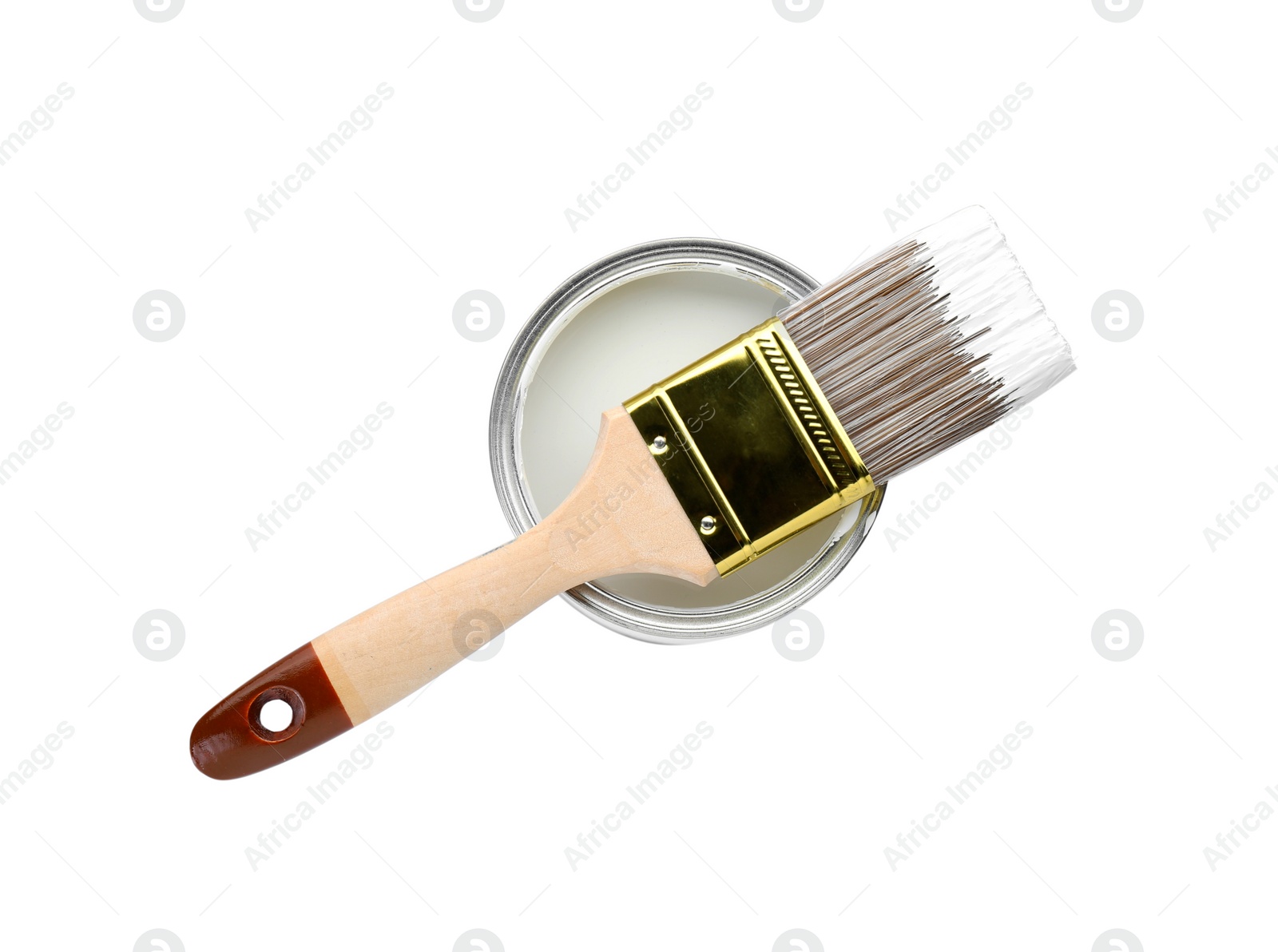 Photo of Can of color paint with brush isolated on white, top view