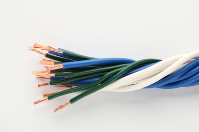 Photo of Electrical wires on white background, closeup view