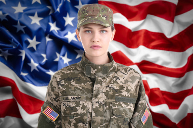 Image of Female soldier and American flag on background. Military service