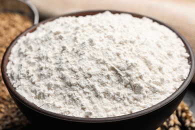 Photo of Organic wheat flour in bowl, closeup view