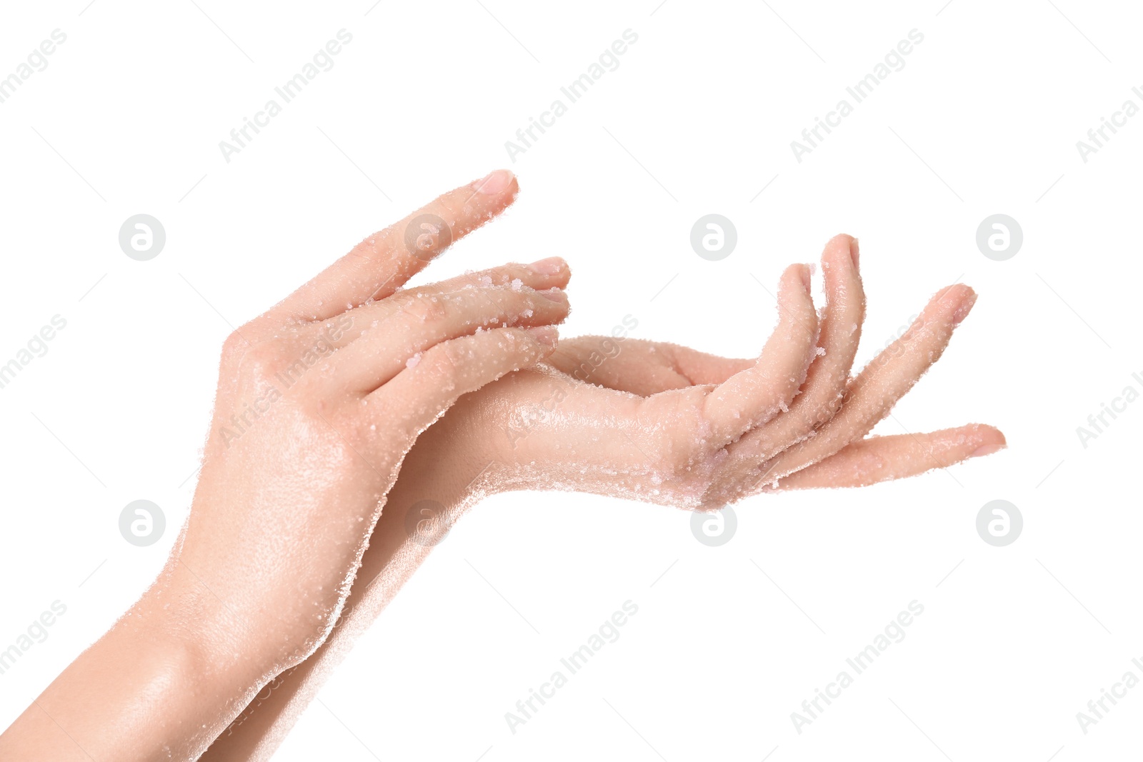 Photo of Young woman applying natural scrub on hands against white background