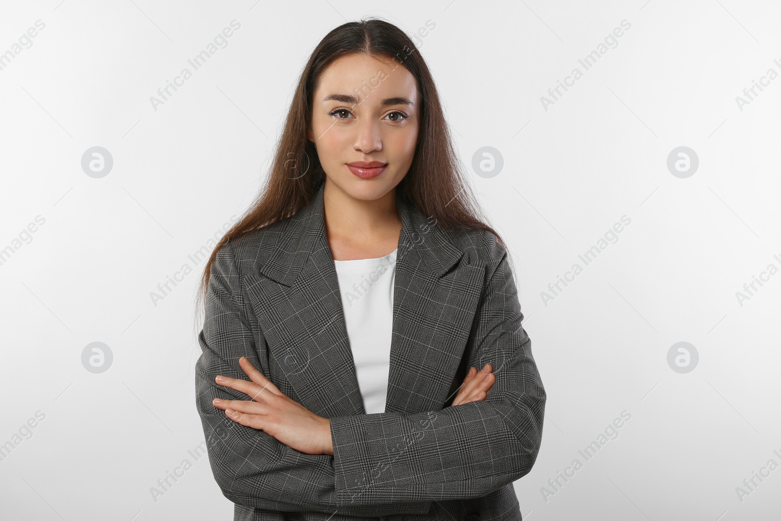 Photo of Portrait of beautiful young woman in stylish jacket on white background