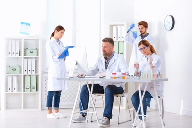 Photo of Scientists working in laboratory. Research and analysis