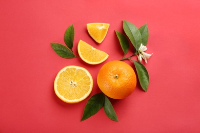 Delicious oranges on red background, flat lay