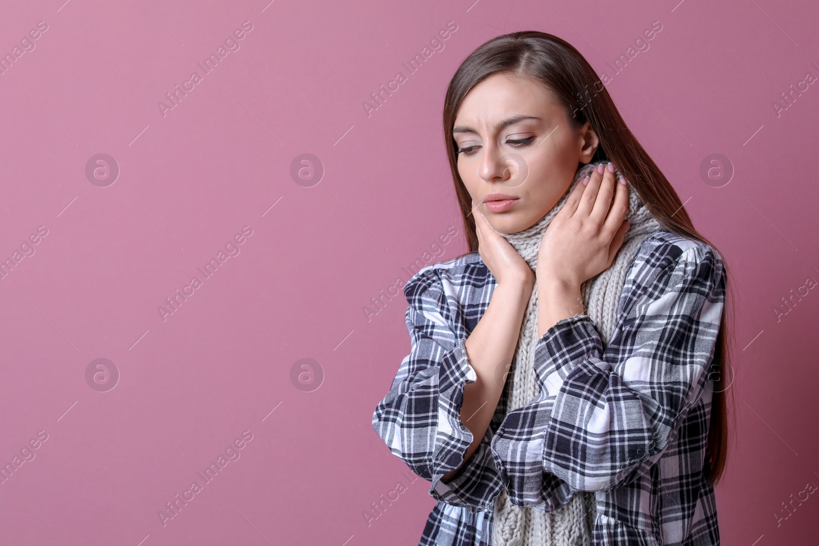 Photo of Young woman coughing on color background