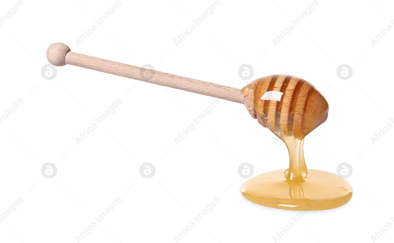 Photo of Natural honey dripping from dipper on white background