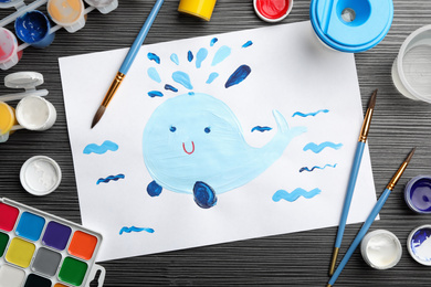 Photo of Flat lay composition with child's painting of whale on grey wooden table