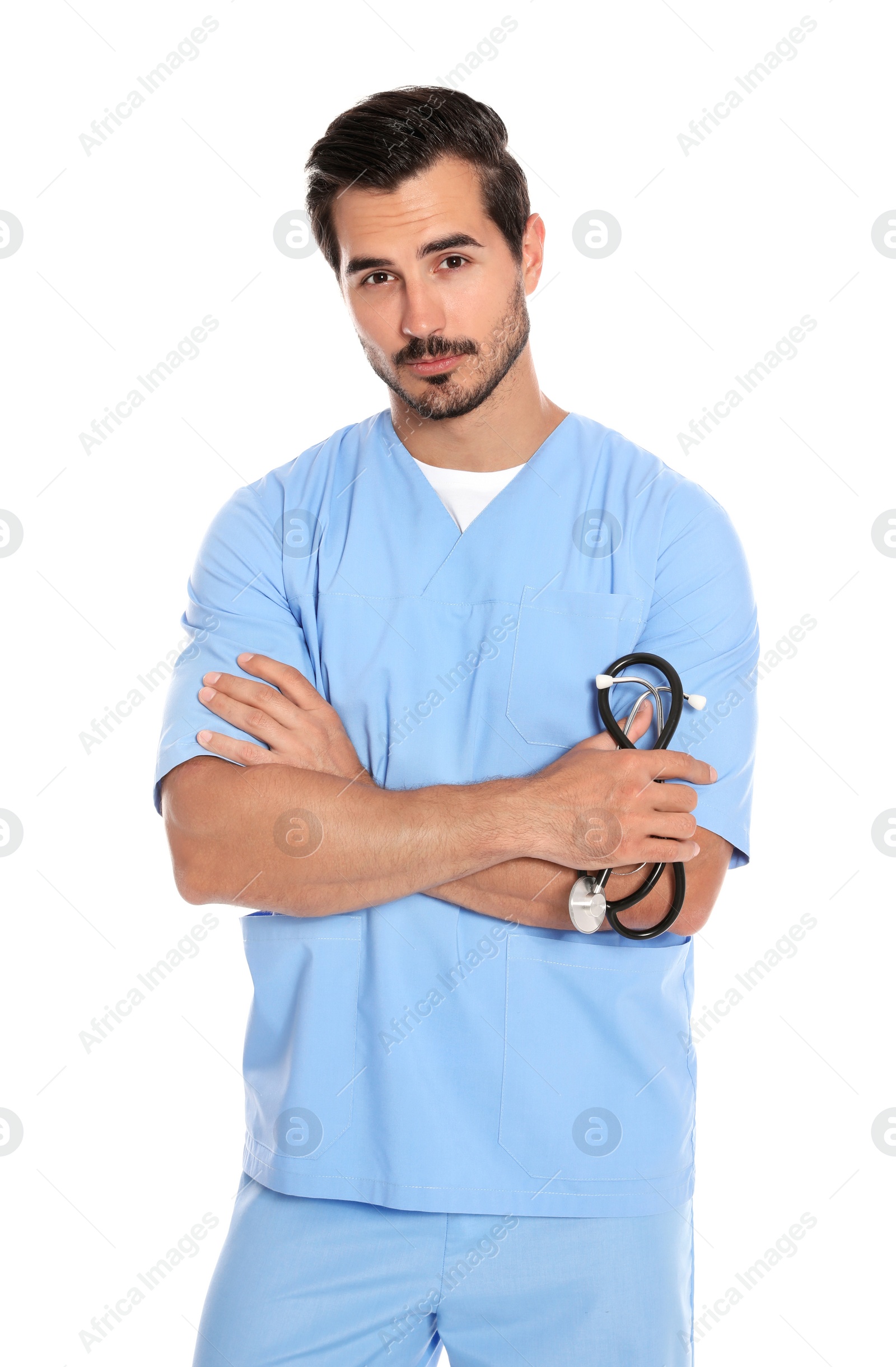 Photo of Young male doctor in uniform with stethoscope on white background. Medical service