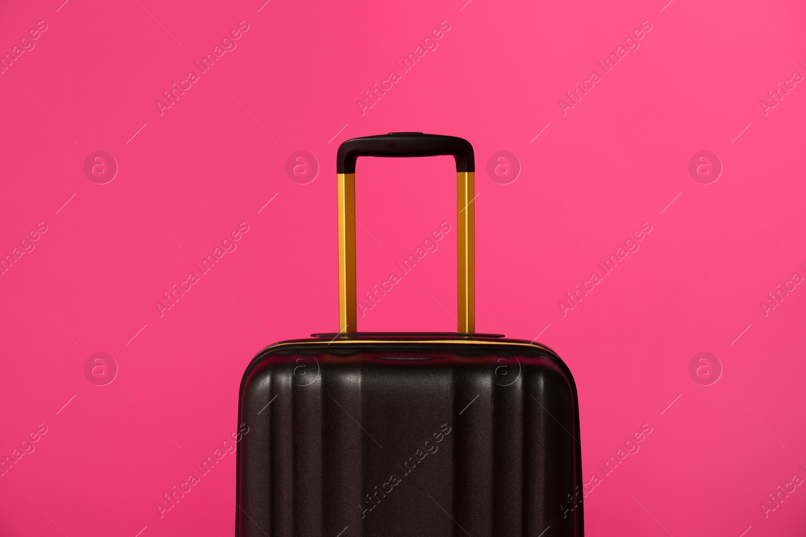 Photo of Stylish carry on suitcase on color background