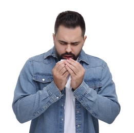 Sick man with tissue coughing on white background