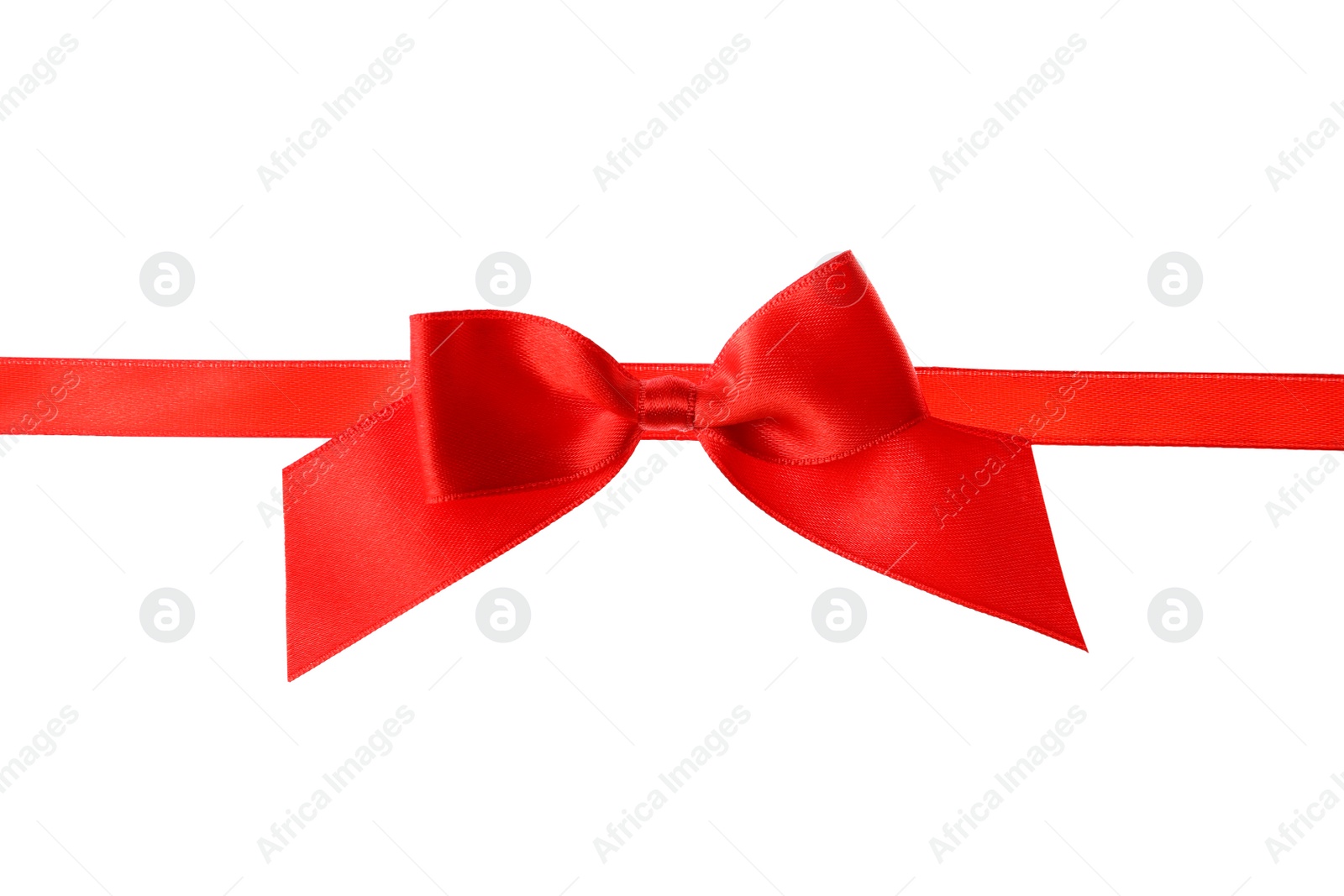 Photo of Red ribbon with bow on white background. Festive decoration