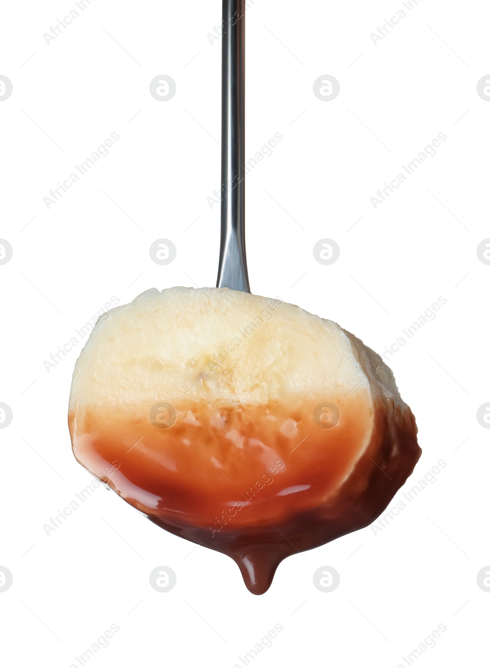 Photo of Banana with chocolate on fondue fork against white background