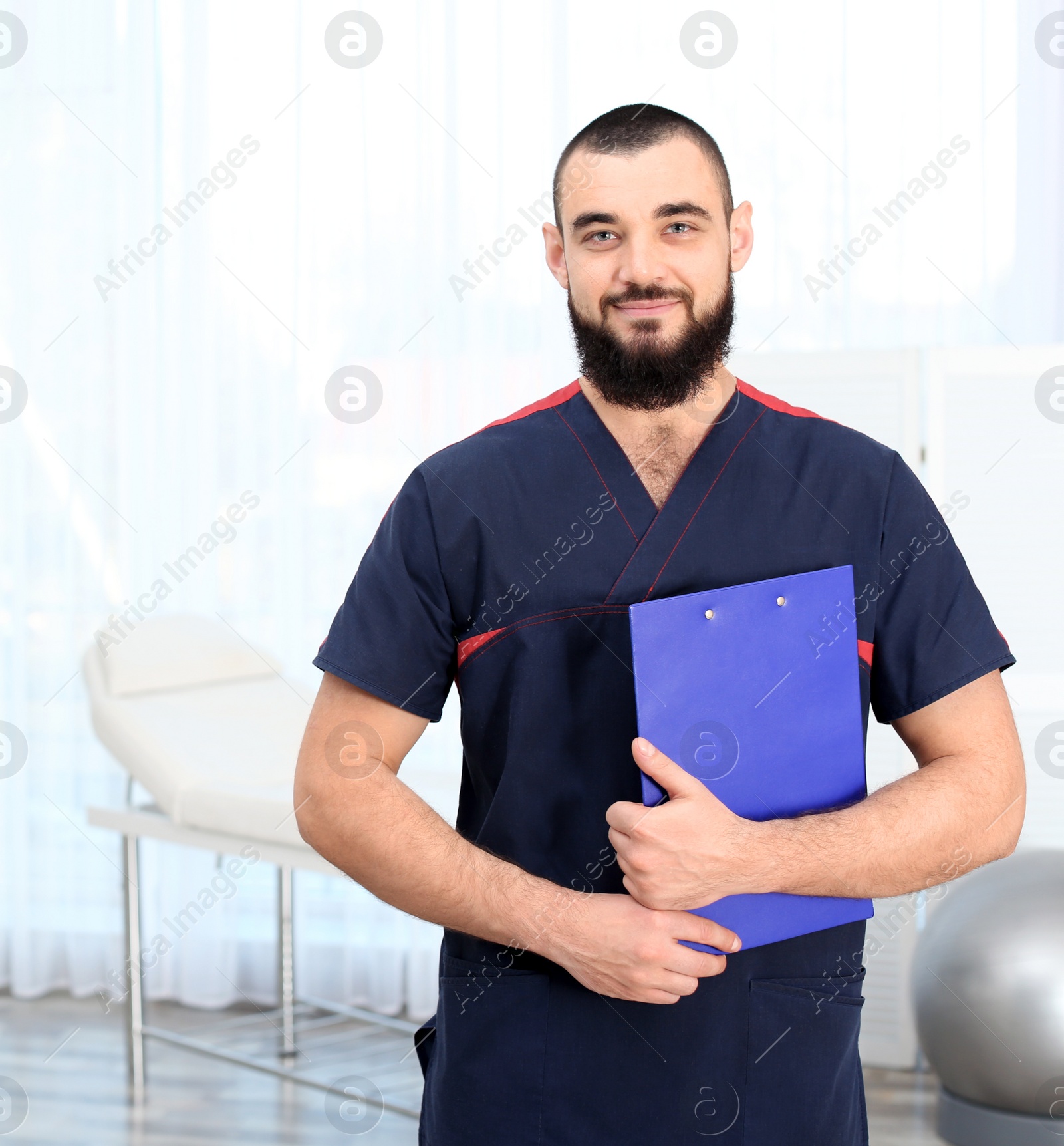 Photo of Professional physiotherapist waiting for patients in rehabilitation clinic