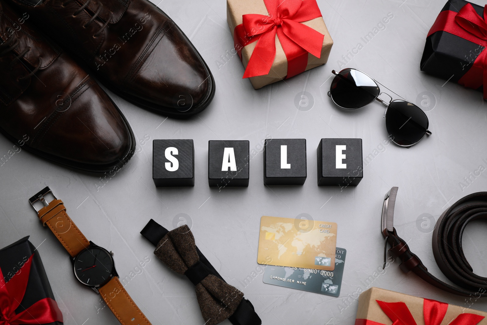 Photo of Flat lay composition with word Sale on grey background