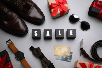 Photo of Flat lay composition with word Sale on grey background