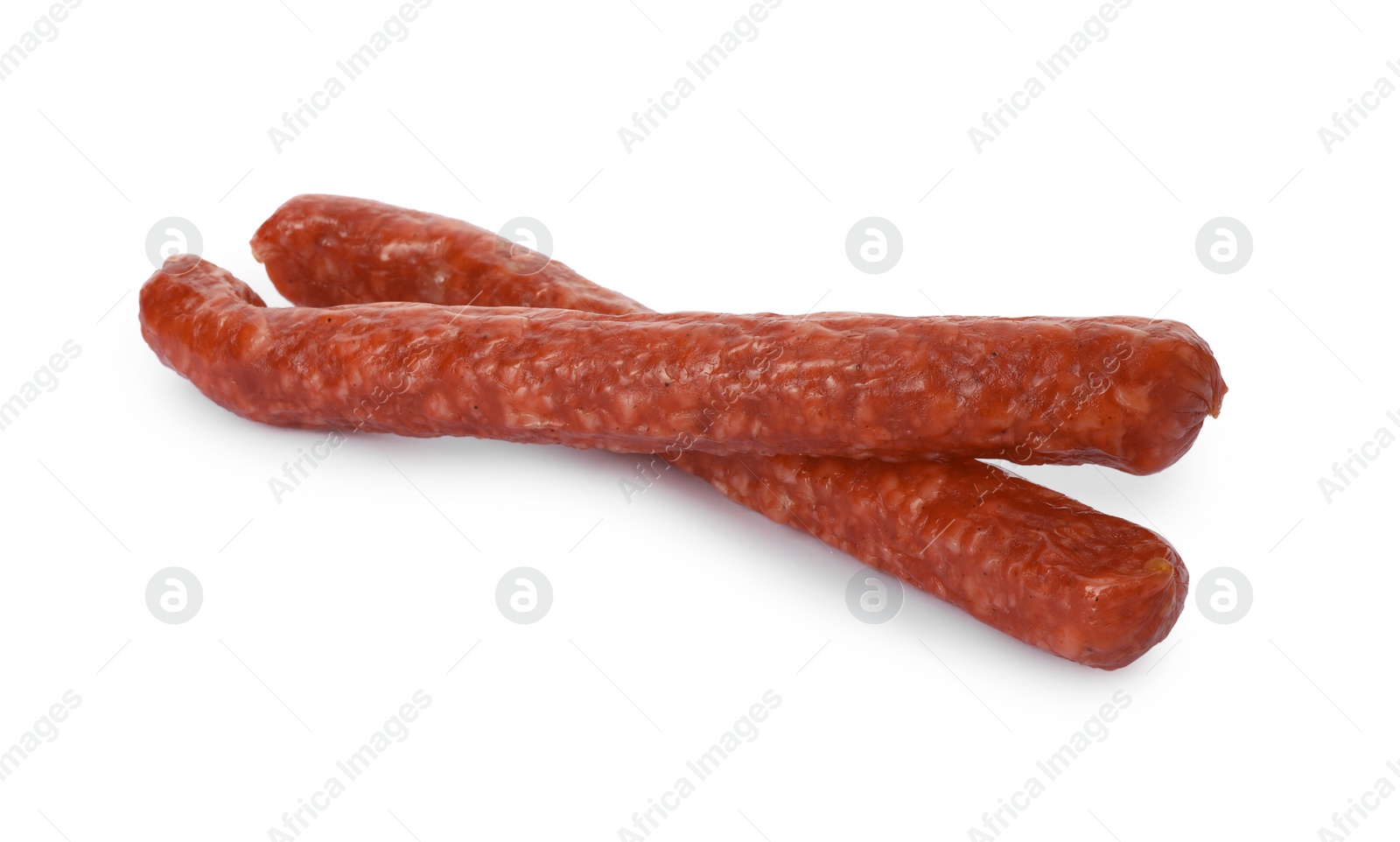 Photo of Thin dry smoked sausages isolated on white