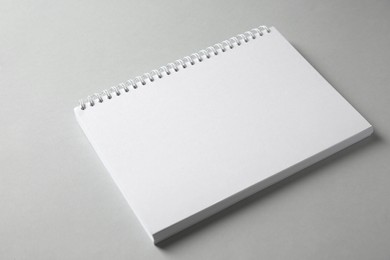 Photo of Blank notebook on grey background. Mockup for design