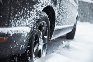 Closeup view of car on snowy country road