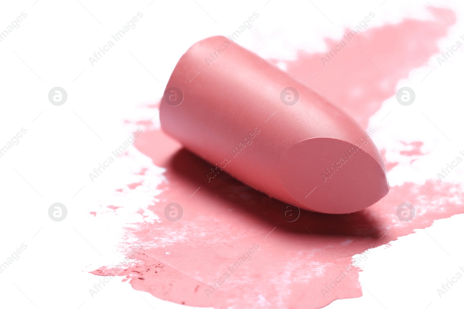 Photo of Pink lipstick and smear on white background