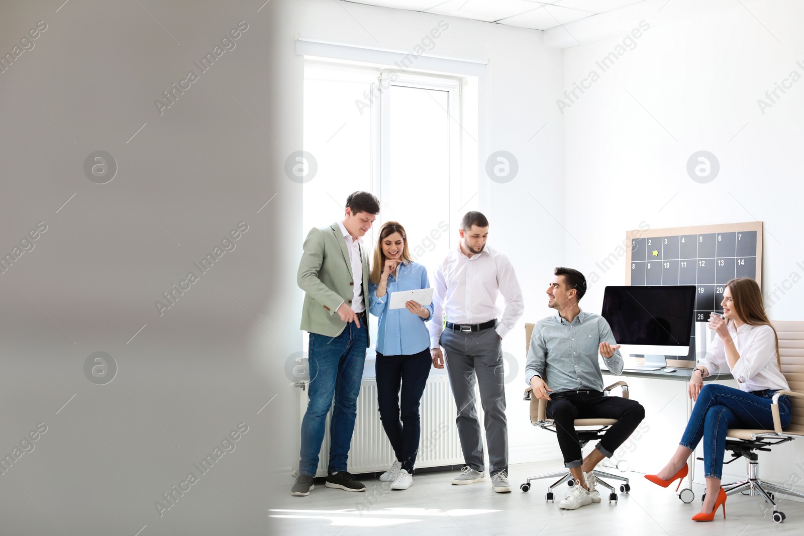 Photo of Young people having business training in office