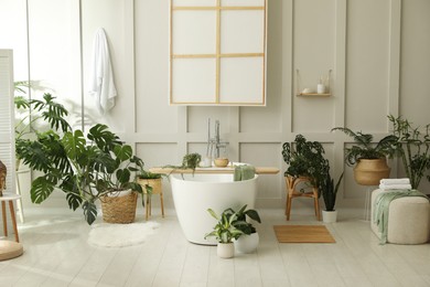 Stylish bathroom interior with green plants. Home design