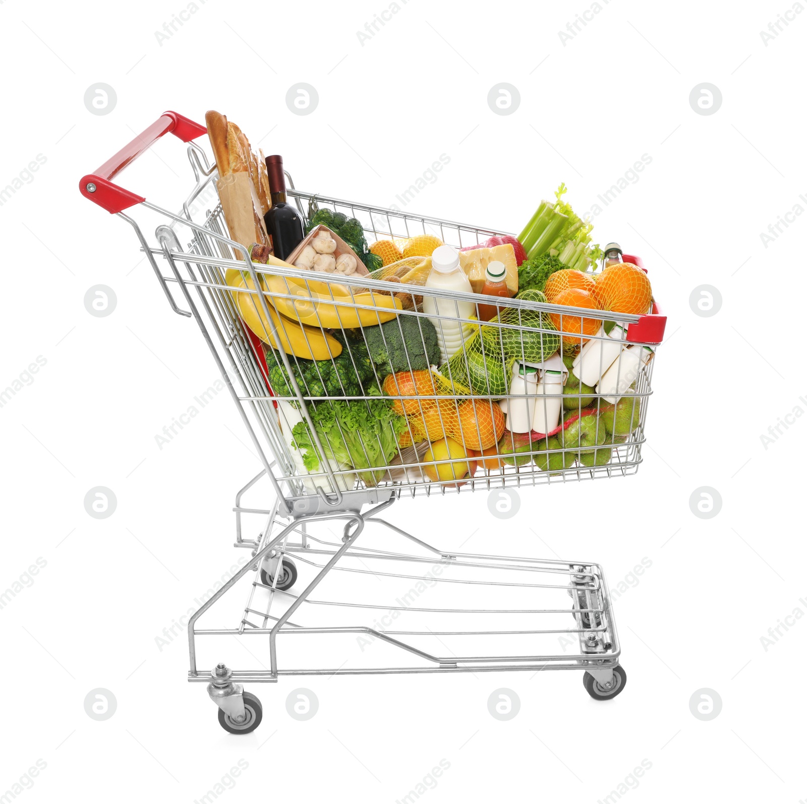 Photo of Shopping cart full of groceries on white background