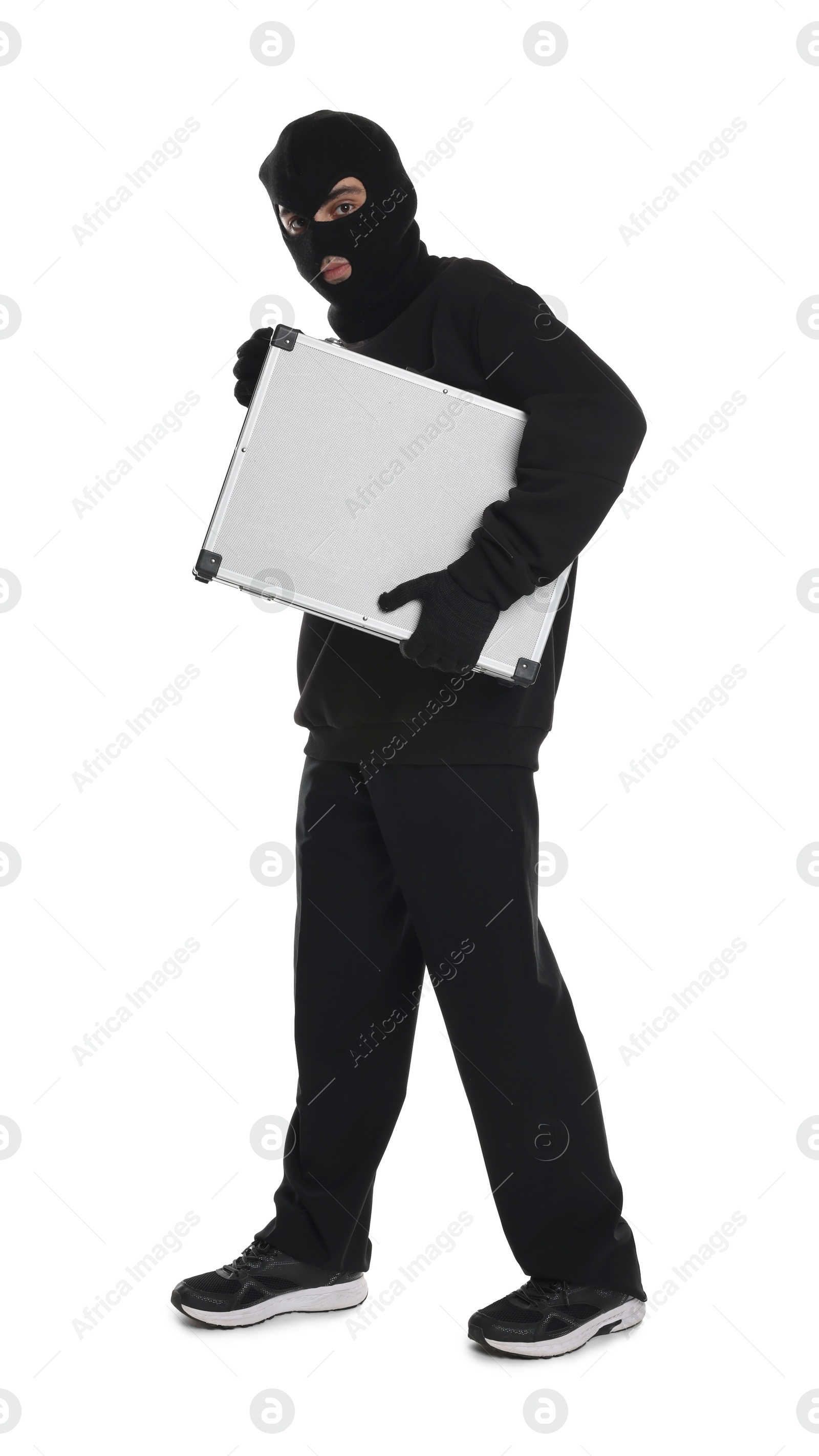 Photo of Thief in balaclava with briefcase of money on white background