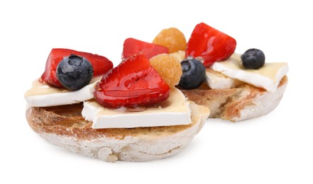 Tasty sandwiches with brie cheese and fresh berries isolated on white