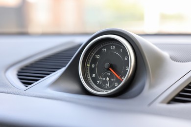 Photo of Tachometer inside of modern car, closeup view