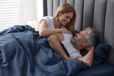 Photo of Lovely mature couple in bed at home