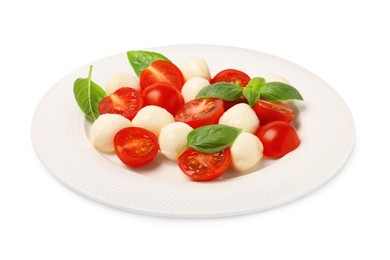 Plate of delicious Caprese salad with tomatoes, mozzarella and basil isolated on white