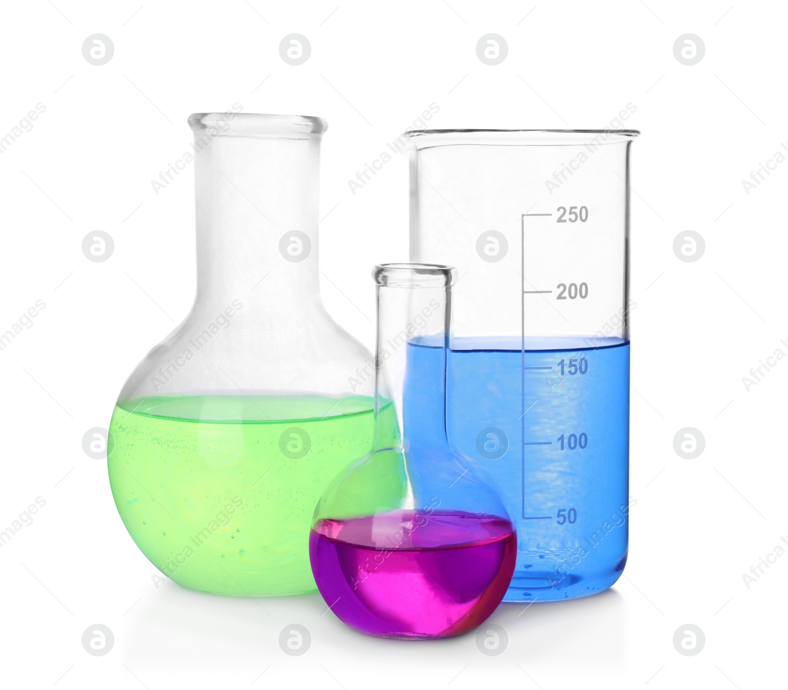 Photo of Different laboratory glassware with colorful liquids on white background