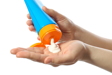 Photo of Woman applying sun protection cream on hand against white background, closeup