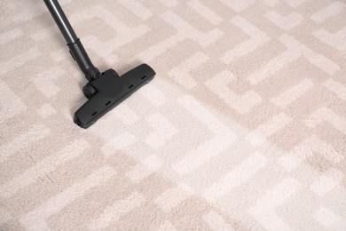 Vacuuming carpet. Clean area after using device, closeup