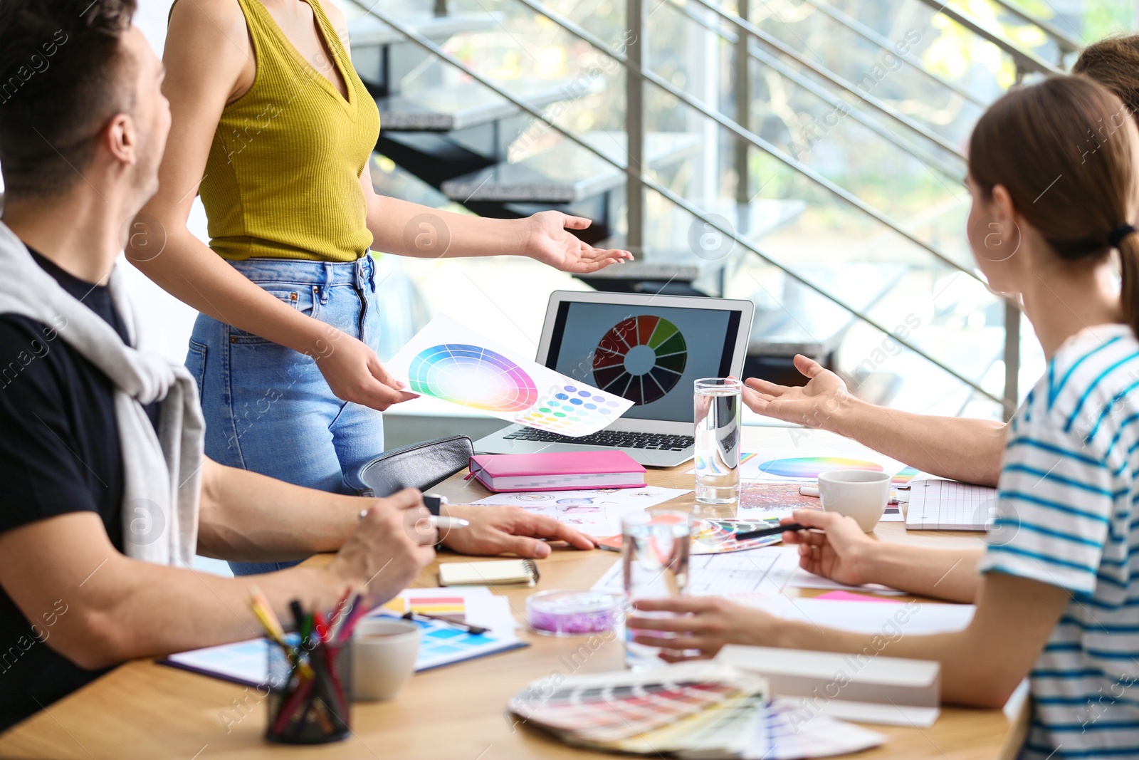 Photo of Professional team of interior designers  working in office, closeup